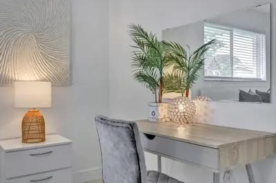 a room with a desk with a chair and a mirror at Luxury 7BR Villa Vizcaya Pool Sauna Gym Golf in Miami