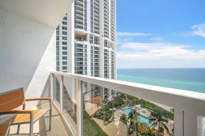 a balcony with a view of the ocean at TRUMP INTERNATIONAL BEACH RESORT 2 BEDROOM APARTMENT 1600 Sqf OCEAN FRONT in Miami Beach