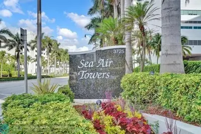 a sign at the entrance to the sea air towers resort at Penthouse Beach Front 1st line, 2 BR, 2 BA, New Decoration & Furnitures, unobstructed view of the beautiful Atlantic, free parking in Hollywood