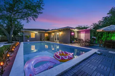 a swimming pool with a pool noodle in a house at La Playita 4-BR Heated Pool Miami 16 Guests in Miami