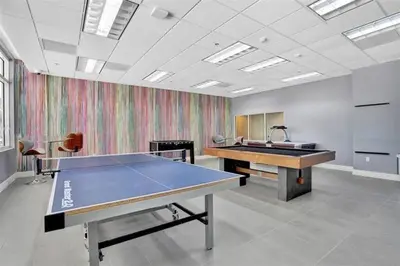 an empty room with a ping pong table in it at 37th floor Amazing spacious unit with parking in Miami