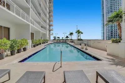a swimming pool in the middle of a building at 37th floor Amazing spacious unit with parking in Miami