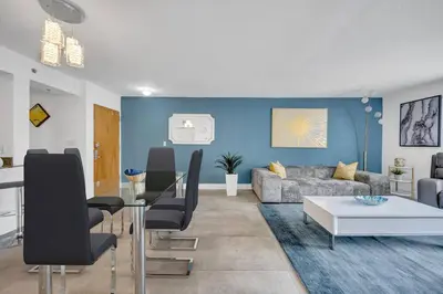 a living room with a couch and a table at 37th floor Amazing spacious unit with parking in Miami