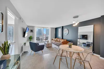 a living room with a table and a couch at Ocean front private unit in Miami
