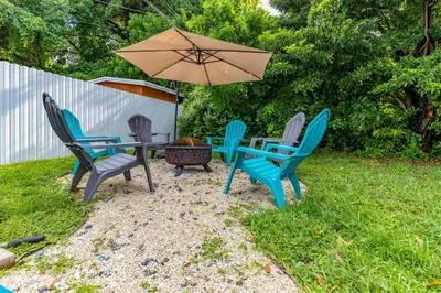 a group of chairs and a table with an umbrella at Angies-10 Min Beach-10 People-Terrace-Families in Hollywood