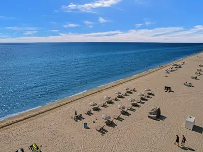 an overhead view of a beach with chairs and umbrellas at Luxury Beachfront Ocean View Beach Access-817 in Miami Beach
