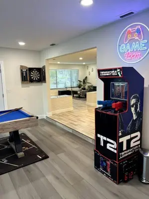 a room with a game room with a video game machine at Modern Tropical Oasis with Arcade, HotTub & MiniGolf in Hollywood