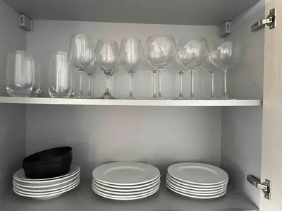 a shelf with wine glasses and plates in a kitchen at Luxury 2 bedroom with ocean view in Hollywood