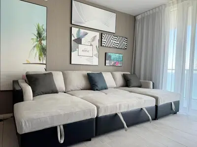 a living room with a large couch in a room at Luxury 2 bedroom with ocean view in Hollywood
