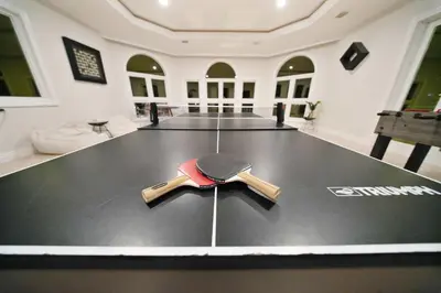 a hat and sword on the floor of a room at Incredible 9 Bedroom 11 Bath Idlewyld Mansion in Fort Lauderdale
