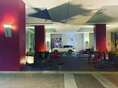 a parking lot with a car in a building at 2 Full Bed BeachWalk Studio, Ocean Nearby, Feels Like Home in Hallandale Beach