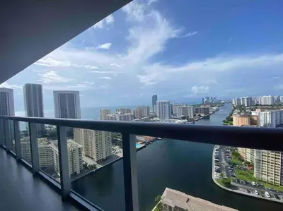 a view of a river from a balcony of a city at Seaside Retreat in Miami, Full Kitchen & Balcony Views -A in Hallandale Beach