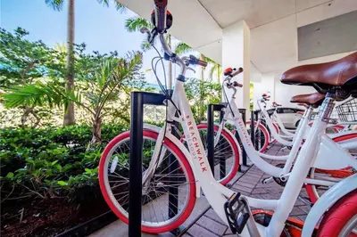 a group of bikes parked next to each other at Cozy BeachWalk Nest, 2 Full Beds, Steps to Ocean in Hallandale Beach