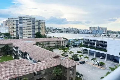 an aerial view of a city with buildings and a harbor at Cozy BeachWalk Nest, 2 Full Beds, Steps to Ocean in Hallandale Beach