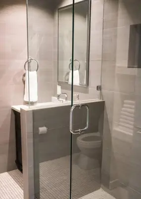 a bathroom with a shower with a toilet and a sink at Villa Palma-Hollywood Beach-Private Pool & Beachwalk! in Hollywood