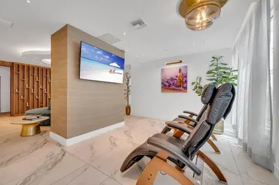 a room with a gym with a flat screen tv at Modern Unit in Downtown Miami With Free Parking in Miami