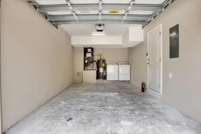 an empty room with two refrigerators and a hallway with at Sistrunk Shades Villas #1 - Brand New Townhomes Downtown Fort Lauderdale in Fort Lauderdale