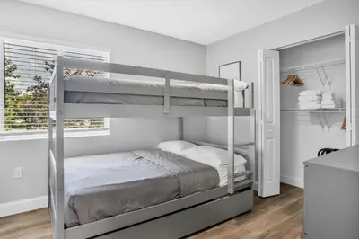 a bedroom with two bunk beds and a window at Sistrunk Shades Villas #2 New Downtown Fort Lauderdale Townhomes in Fort Lauderdale