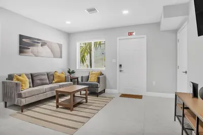 a living room with a couch and a table at Sistrunk Shades Villas #2 New Downtown Fort Lauderdale Townhomes in Fort Lauderdale