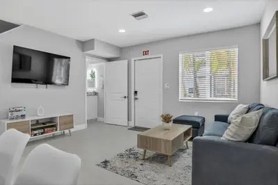 a living room with a couch and a table at Sistrunk Shades Villas #3 - Brand New Townhomes Downtown Fort Lauderdale in Fort Lauderdale