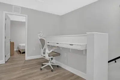 an office with a white desk and a chair at Sistrunk Shades Villas #3 - Brand New Townhomes Downtown Fort Lauderdale in Fort Lauderdale