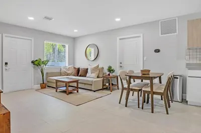 a living room with a couch and a table at 30 Guests 3 Identical Brand New Townhomes in Downtown Fort Lauderdale in Fort Lauderdale