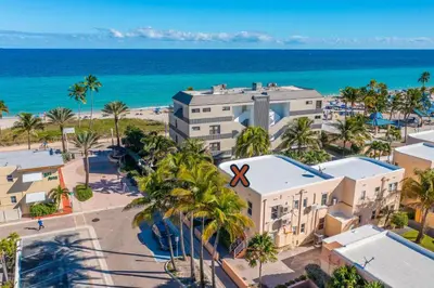 an aerial view of the beach and the ocean at 310 Oasis Paradise in Hollywood