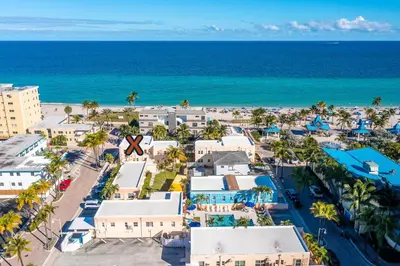 an aerial view of a resort with the beach at 310 Oasis Paradise in Hollywood