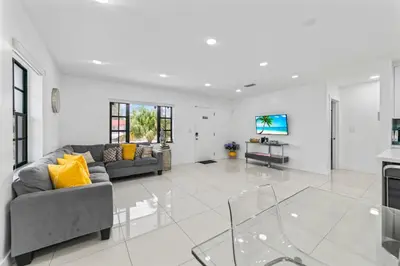 a living room with a couch and a tv at Luxury Vacation House in Miami’s Center! in Miami