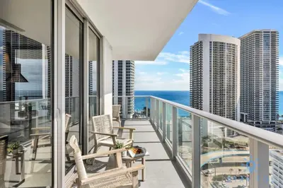 a balcony with chairs and a view of the ocean at Wrap Around Balcony Insane Views Amazing Pools in Hollywood