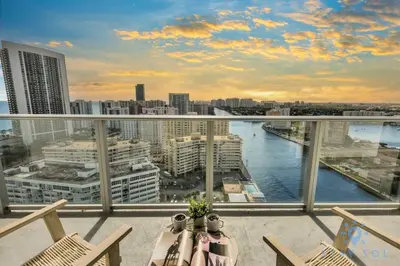 a balcony with chairs and a view of a river at Wrap Around Balcony Insane Views Amazing Pools in Hollywood
