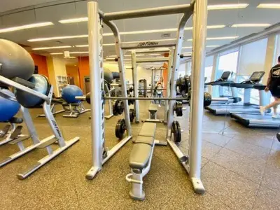 a gym with a bunch of equipment in a room at 21st Floor Luxury Suite at Trump Int Resort in Miami Beach