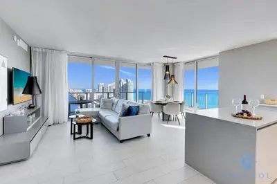 a living room with a couch and a table at Luxury 2Br Front Ocean Bay View Amazing Pools in Hollywood