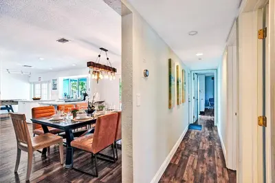 a dining room and kitchen with a table and chairs at Wonderful 4BR and 3BA Villa Heated Pool near Beach in Hollywood
