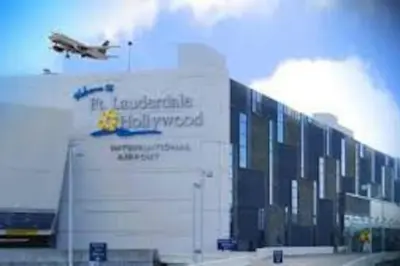 an airplane is flying over a building with a truck at Heart Of Wilton 1 Recently Remodeled in Fort Lauderdale