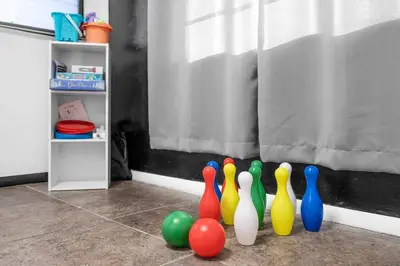 a group of bowling pins sitting in front of a window at Heated Pool Tropical Backyard 3 Bedrooms, 12 min to the Ocean in North Miami Beach
