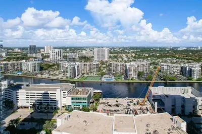 an aerial view of a city with a river and buildings at Beach Paradise a cozy ocean view condo on the beach with free parking in Hollywood