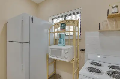 a kitchen with a white refrigerator and a microwave at Refreshing Miami Apartment 4 Mi to the Beach! in Miami