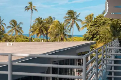 a view from the balcony of a house with palm trees at King bed Rooftop Suite Ocean Dr C304 in Miami Beach