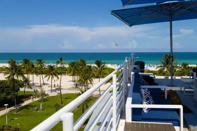 a view of the beach from the balcony of a resort at Rooftop-Pool Suite on Ocean Dr C505 in Miami Beach