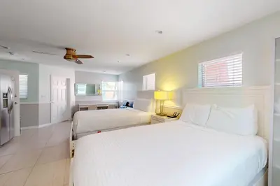 a hotel room with two beds and a kitchen at Hollywood Bungalow in Hollywood