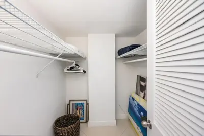 a room with white walls and a white door at 2-Bedroom Beach Condo in Sunny Isles in Miami Beach
