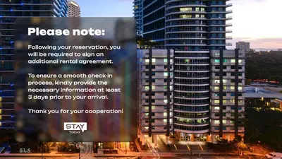 a billboard in front of a tall building at Skyline Serenity - Brickell On The River - Bi-Level Loft with Breathtaking Views On The Ocean in Miami