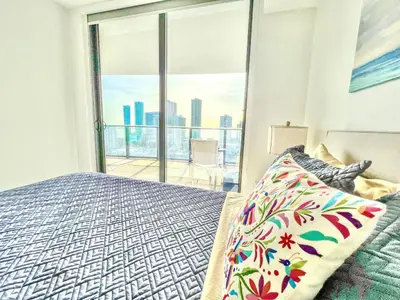 a bedroom with a bed and a large window at Lunabase Tropical Refuge in Miami
