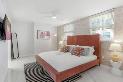 a bedroom with a large bed and a window at Brickell Bay View Oasis with Pool Hot Tub and Gym in Miami