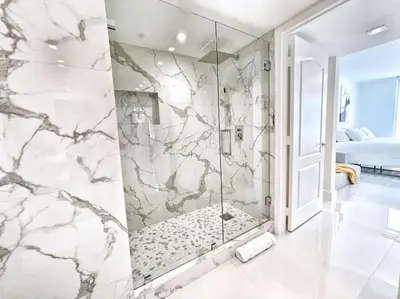 a bathroom with a shower with a glass door at Blissful Sky Residence with Ocean and City Views in Miami
