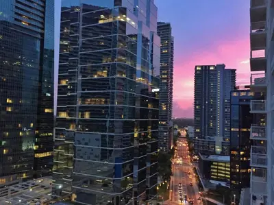 a view of a city at night with buildings at Modern Sky Residence with Ocean and City Views in Miami