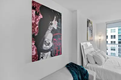 a white room with a couch and a picture on the wall at Modern Sky Residence with Ocean and City Views in Miami