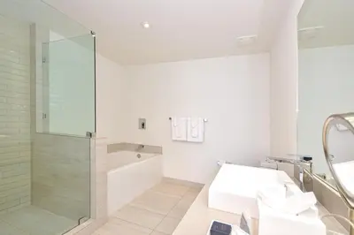 a bathroom with a shower and a sink at Oceanview 2BR Suite At Hyde Beach House - 5☆ Amenities in Hollywood