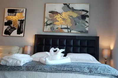 a bedroom with a bed with two swans on it at Amazing Studio Located in Upscale-Prime Location. Walking Distance to Restaurant in Miami